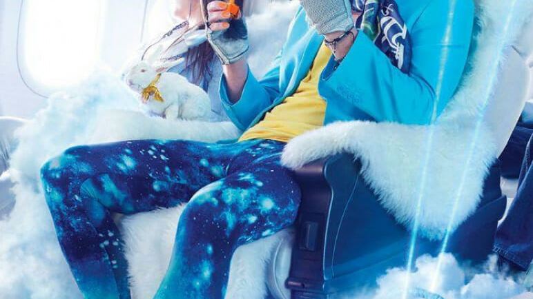 Hair rocker sitting in fur covered airplane seat
