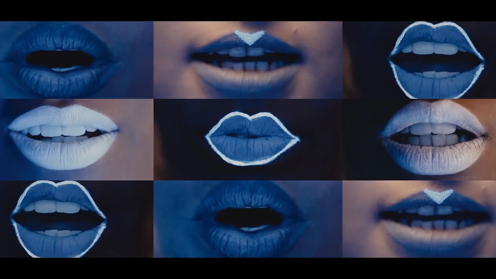 A grid of nine close-up images of lips, each uniquely painted with blue and white patterns, shown against a dark background.